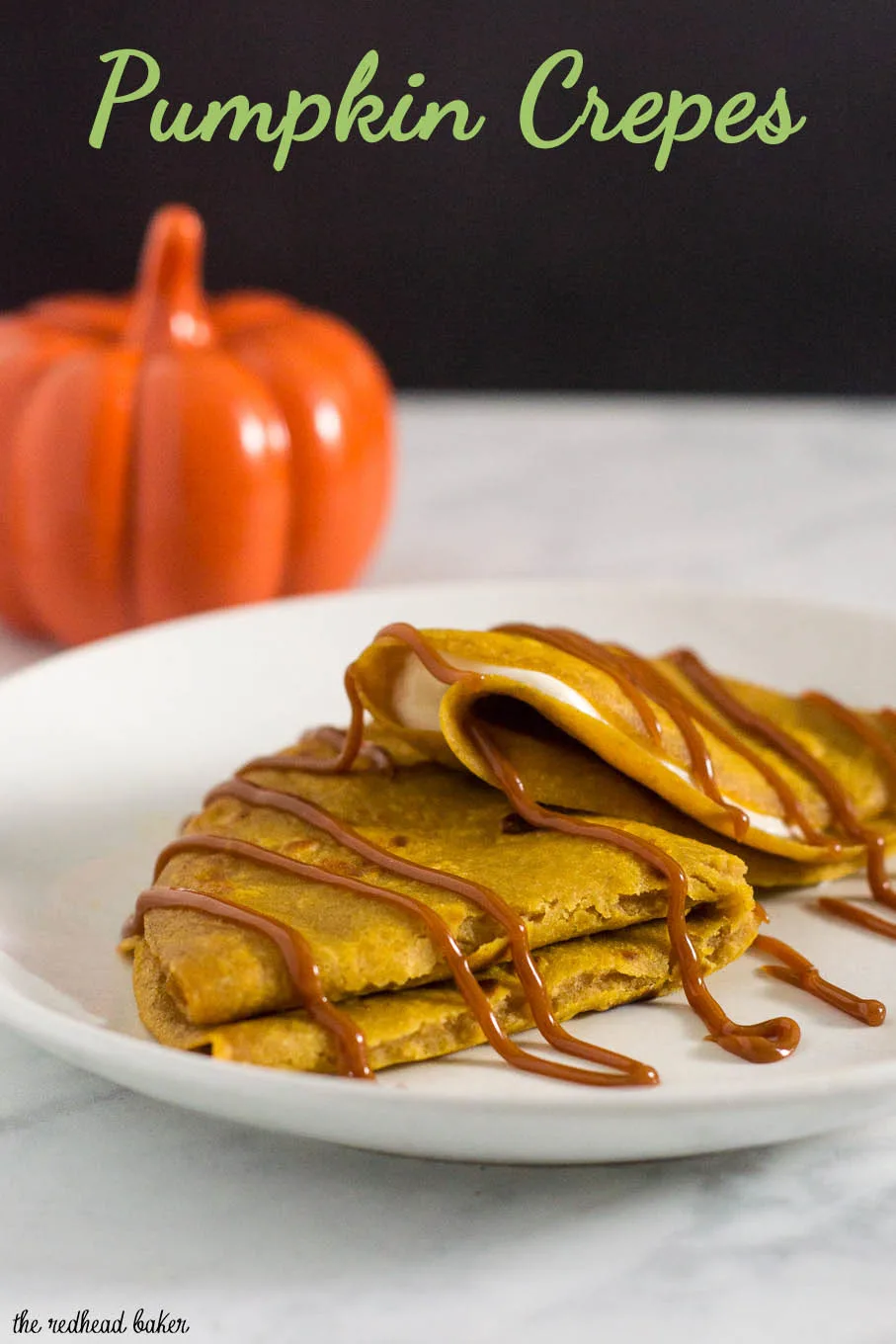 Pumpkin crepes are very thin dessert pancakes, folded over sweetened cream cheese filling and drizzled with dulce de leche. #PumpkinWeek