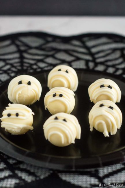 Boo! Scare your Halloween dinner or party guests with these easy-to-make white chocolate mummy truffles made with white chocolate ganache! #ProgressiveEats