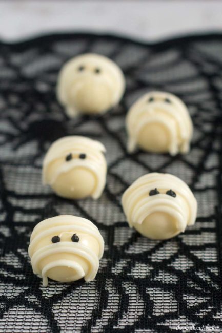 Boo! Scare your Halloween dinner or party guests with these easy-to-make white chocolate mummy truffles made with white chocolate ganache! #ProgressiveEats