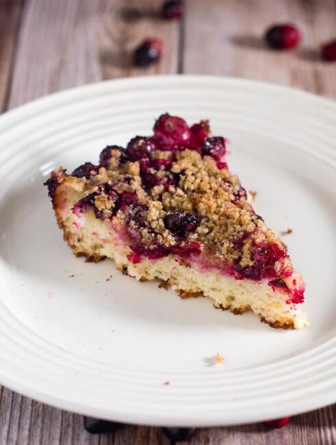 Cranberry crumb cake combines an orange-flavored cake, sugared cranberries and crumb topping for a delicious holiday breakfast or dessert.