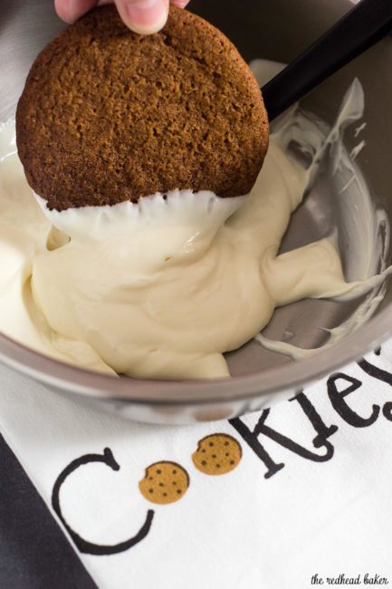 Warmly spiced gingerbread cookies get fancy for the holidays with a dip in white chocolate. Santa will love getting these cookies on Christmas Eve!