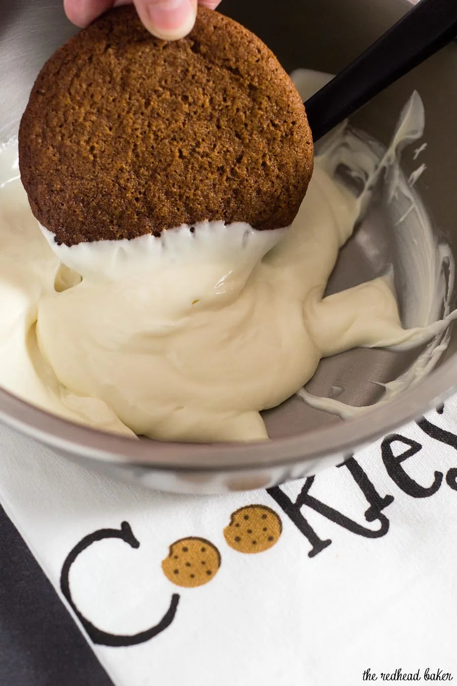 Warmly spiced gingerbread cookies get fancy for the holidays with a dip in white chocolate. Santa will love getting these cookies on Christmas Eve! 