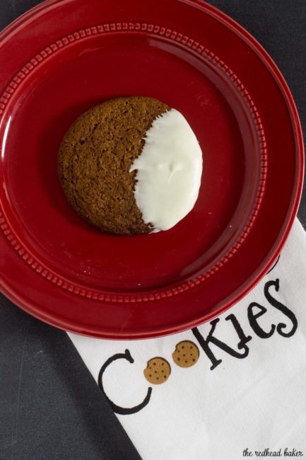 Warmly spiced gingerbread cookies get fancy for the holidays with a dip in white chocolate. Santa will love getting these cookies on Christmas Eve!