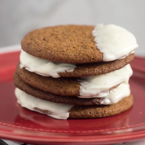 Warmly spiced gingerbread cookies get fancy for the holidays with a dip in white chocolate. Santa will love getting these cookies on Christmas Eve!