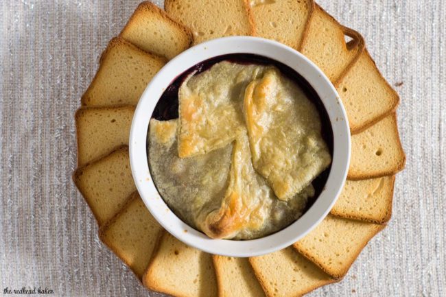 Baked brie en croute is a luxurious appetizer, and this one goes the extra mile with a flavorful cabernet cranberry cherry sauce. #ProgressiveEats