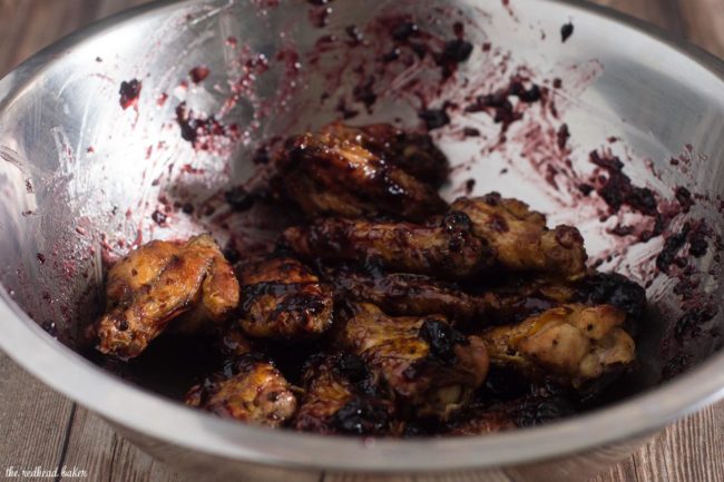 These spicy-sweet chicken wings are coated in a glaze of Smucker's Fruit & Honey Blueberry Lemon Fruit Spread, shallot, vinegar and chipotle chili powder. #EasyHolidayEats #ad