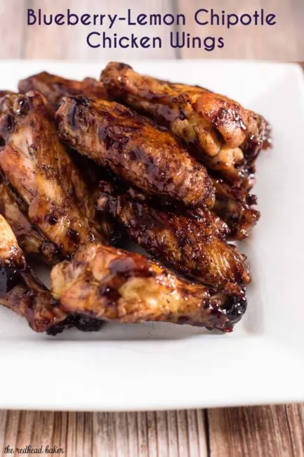 These spicy-sweet chicken wings are coated in a glaze of Smucker's Fruit & Honey Blueberry Lemon Fruit Spread, shallot, vinegar and chipotle chili powder. #EasyHolidayEats #ad