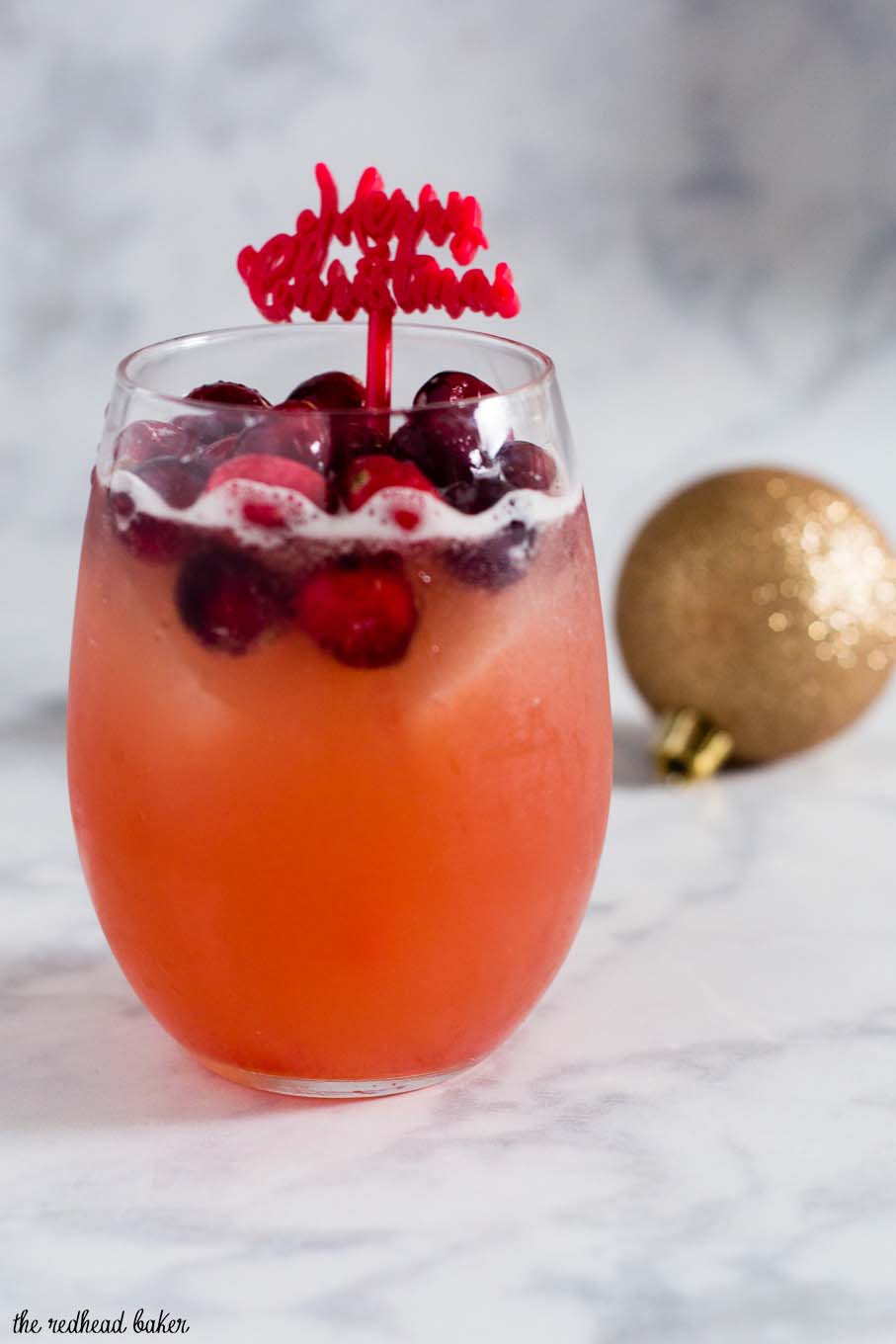 Cranberry cinnamon whiskey sour is an easy, festive cocktail for the Christmas season. Shake up a batch for your holiday party!