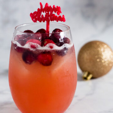 Cranberry cinnamon whiskey sour is an easy, festive cocktail for the Christmas season. Shake up a batch for your holiday party!