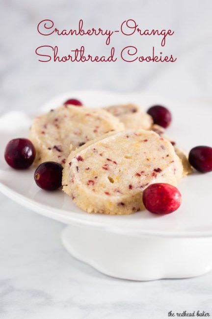 Shortbread cookies are a Scottish Christmas tradition. This version of the crumbly cookie is flavored with dried cranberries and orange zest. #IntnlCookies
