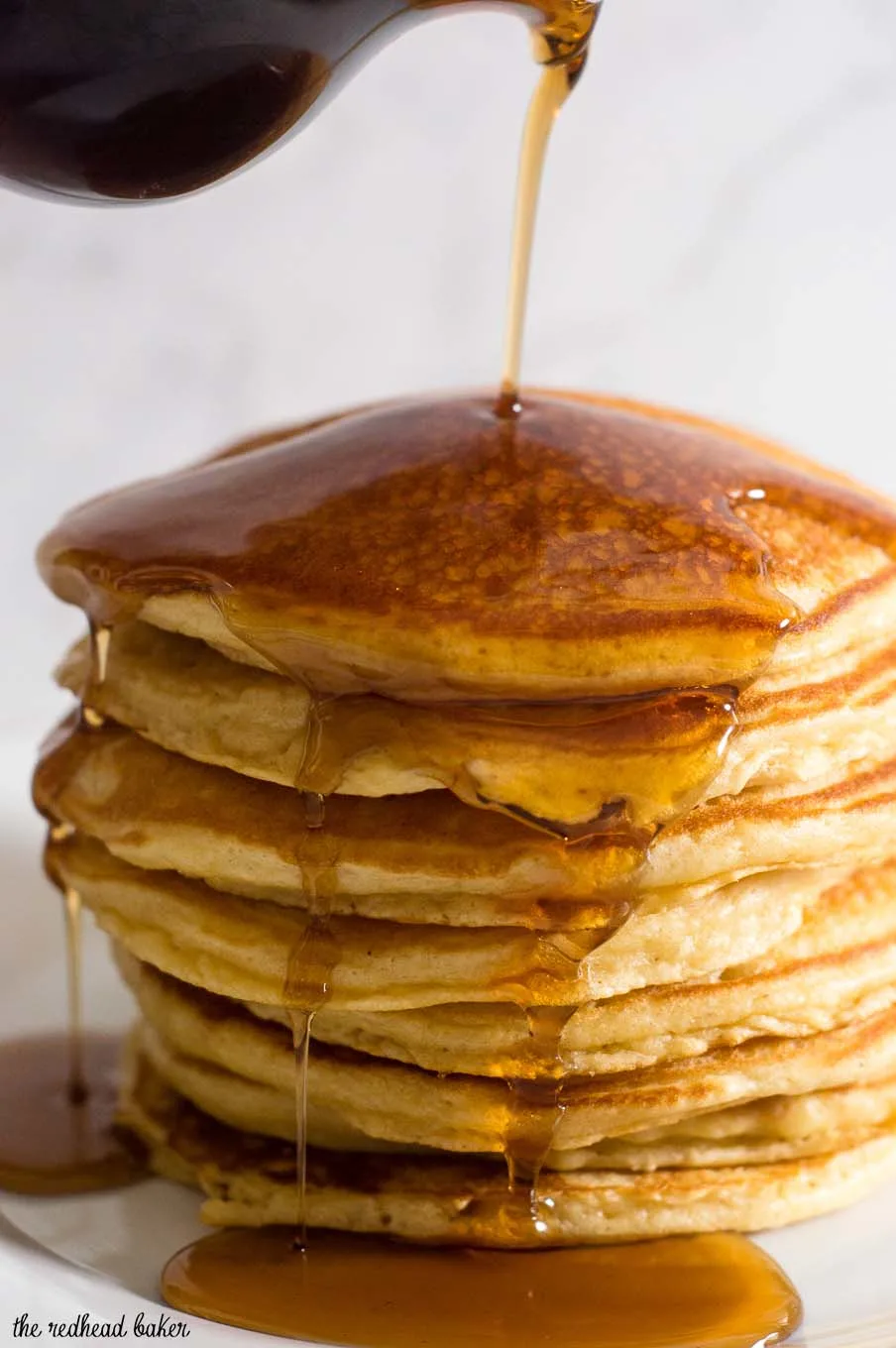 Eggnog pancakes are light and fluffy with the subtle flavor of the traditional Christmas drink, drizzled with nutmeg-infused maple syrup.