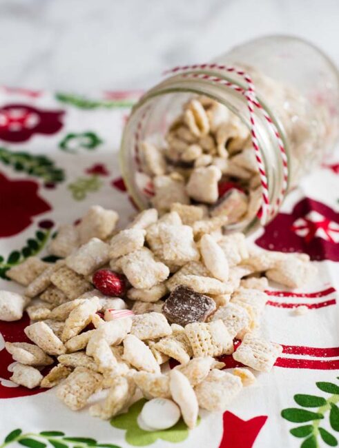 When you leave out Santa's cookies and milk, don't forget the reindeer chow! This snack mixes white chocolate muddy buddies with peppermint treats.