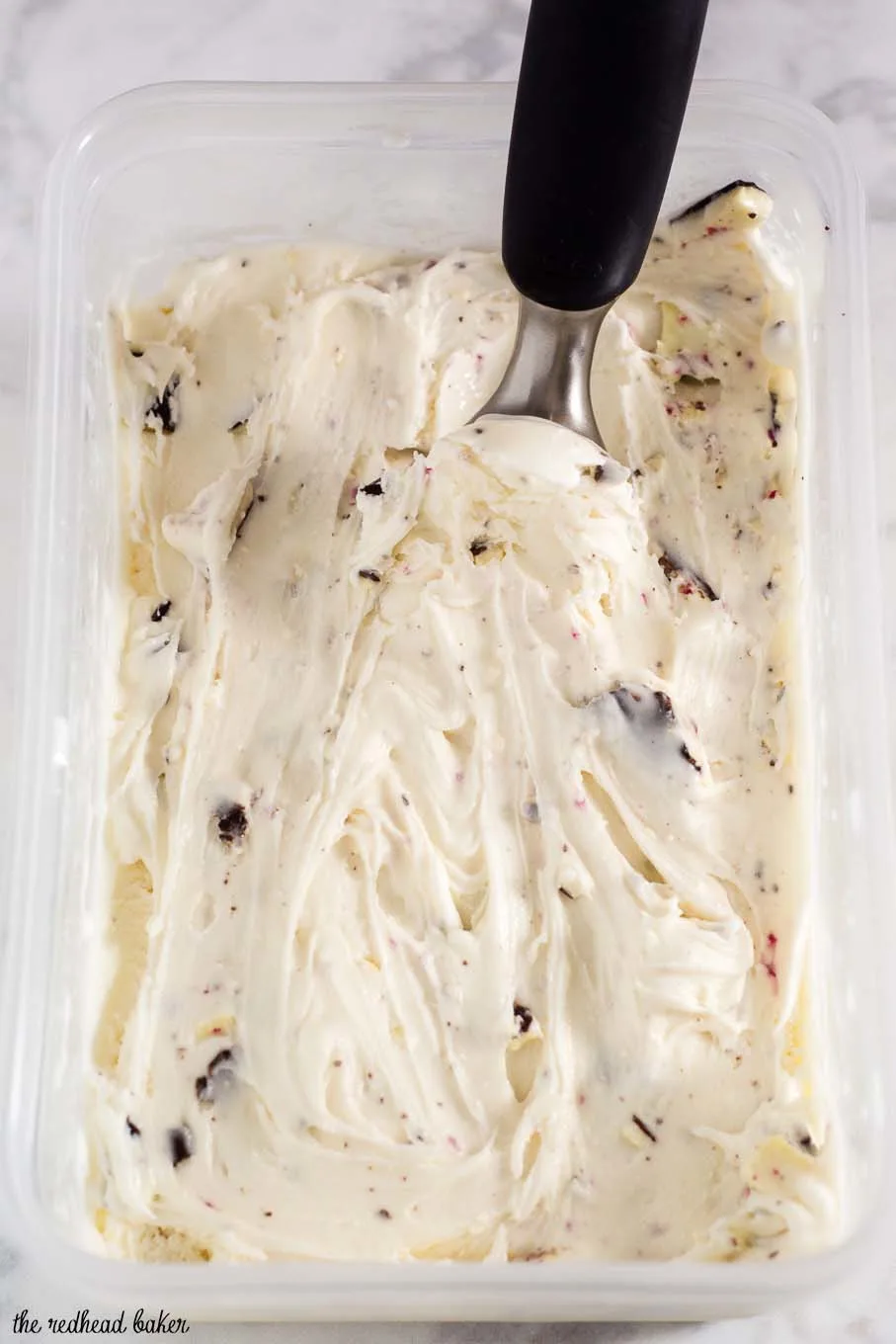 Rich white chocolate peppermint bark ice cream is a delicious holiday treat, with bits of the popular Christmas treat mixed throughout the ice cream.