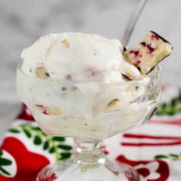 Rich white chocolate peppermint bark ice cream is a delicious holiday treat, with bits of the popular Christmas treat mixed throughout the ice cream.