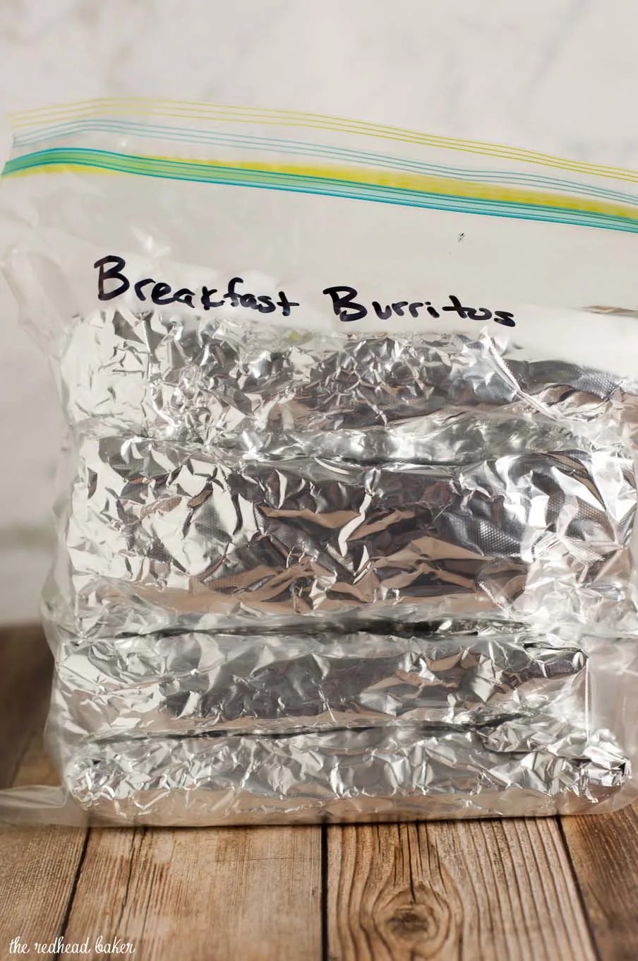 Customize these freezer-friendly egg and cheese breakfast burritos however you like. In the morning, just unwrap, reheat and go!