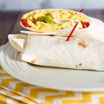 Customize these freezer-friendly egg and cheese breakfast burritos however you like. In the morning, just unwrap, reheat and go!