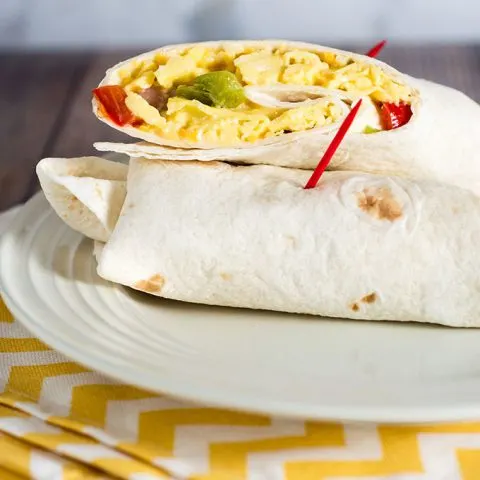 Customize these freezer-friendly egg and cheese breakfast burritos however you like. In the morning, just unwrap, reheat and go!