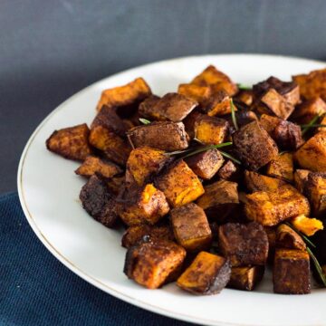 Cinnamon vanilla roasted sweet potatoes are a different, delicious way to enjoy the root vegetable. So easy and ready in 30 minutes!