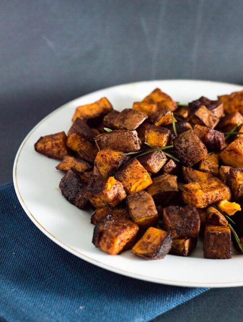 Cinnamon vanilla roasted sweet potatoes are a different, delicious way to enjoy the root vegetable. So easy and ready in 30 minutes!