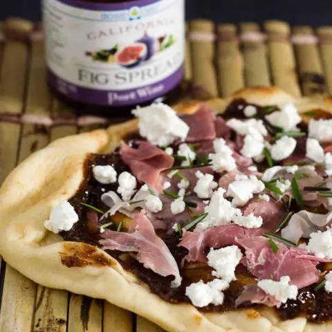 Indian flatbread makes a great crust for pizza! This na'an pizza is topped with fig jam, tangy goat cheese and salty prosciutto.