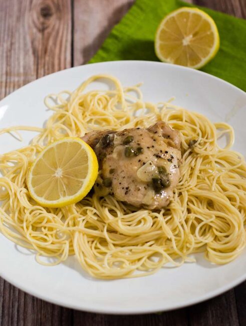 Chicken piccata, ready in under 30 minutes! This dish uses quick-cooking chicken thighs instead of pounded-thin breasts, and skips the flour coating. #SundaySupper