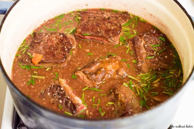 Beef short ribs become fall-off-the-bone tender in a braise of red wine, beef stock, and garlic. Serve over mashed potatoes for a true comfort meal.