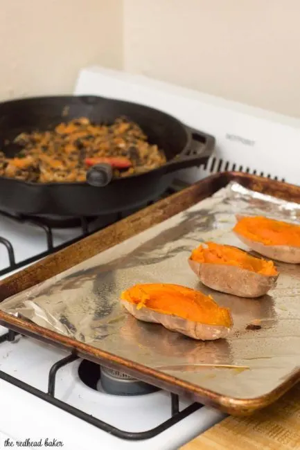 Twice-baked sweet potatoes are stuffed with a mixture of mashed sweet potatoes, black beans, onion, garlic and spices, and topped with melty Borden&reg; Cheese for a healthier vegetarian dinner. #BordenCheeseLove #Ad