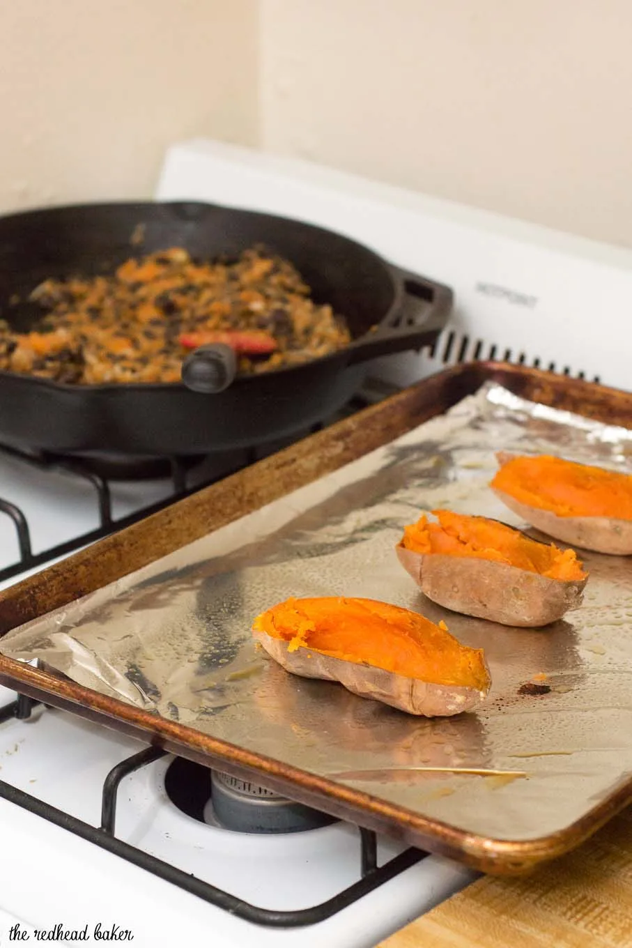 Twice-baked sweet potatoes are stuffed with a mixture of mashed sweet potatoes, black beans, onion, garlic and spices, and topped with melty Borden® Cheese for a healthier vegetarian dinner. #BordenCheeseLove #Ad