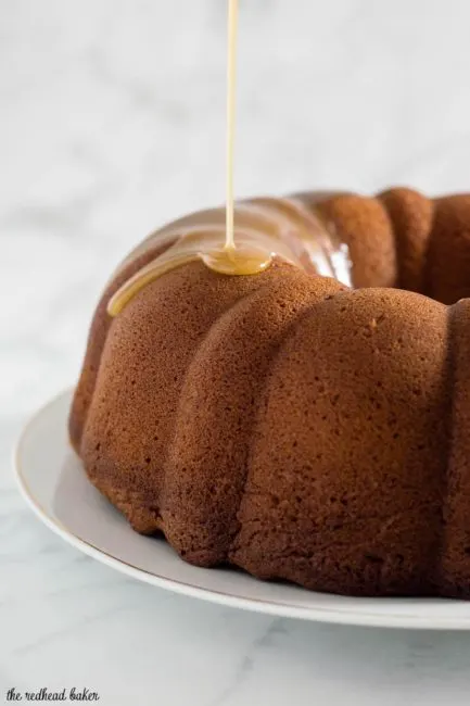 Apple butter pound cake has delicious apple flavor with hints of cinnamon, a ripple of apple butter, and a creamy caramel glaze.