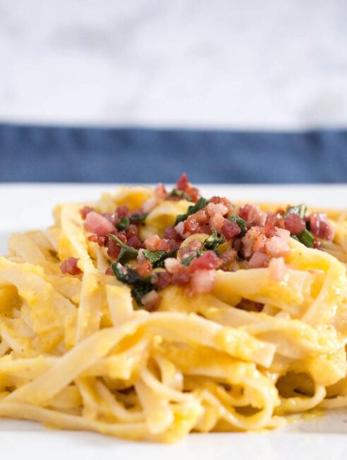 Not a true pasta carbonara, this dish uses pureed butternut squash instead of egg to thicken the sauce that coats the fettuccine.