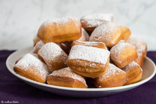 Mardi Gras means it's time for beignets! This is a classic New Orleans recipe, deep-fried then coated in powdered sugar, and served with raspberry jam.