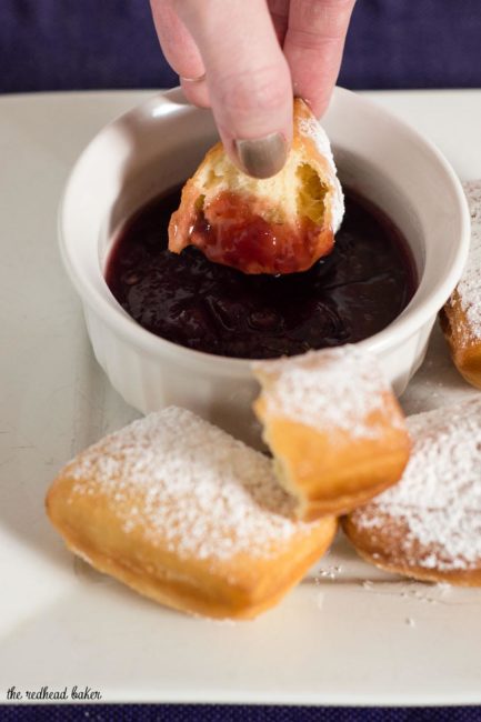 Mardi Gras means it's time for beignets! This is a classic New Orleans recipe, deep-fried then coated in powdered sugar, and served with raspberry jam.