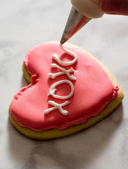 Conversation heart sugar cookies decorated with royal icing deliver your own personal message to your Valentine sweetheart!