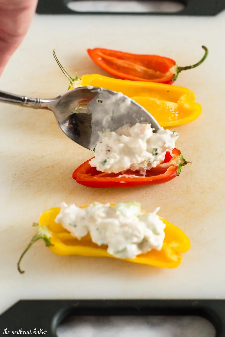 Need a last-minute Valentine's Day appetizer? Try these crab salad stuffed mini peppers! They have complex flavor and don't require any cooking!