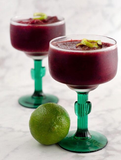 Frozen cherry margaritas are a fun twist on a classic cocktail. Using frozen cherries means you can enjoy this treat any time of the year!