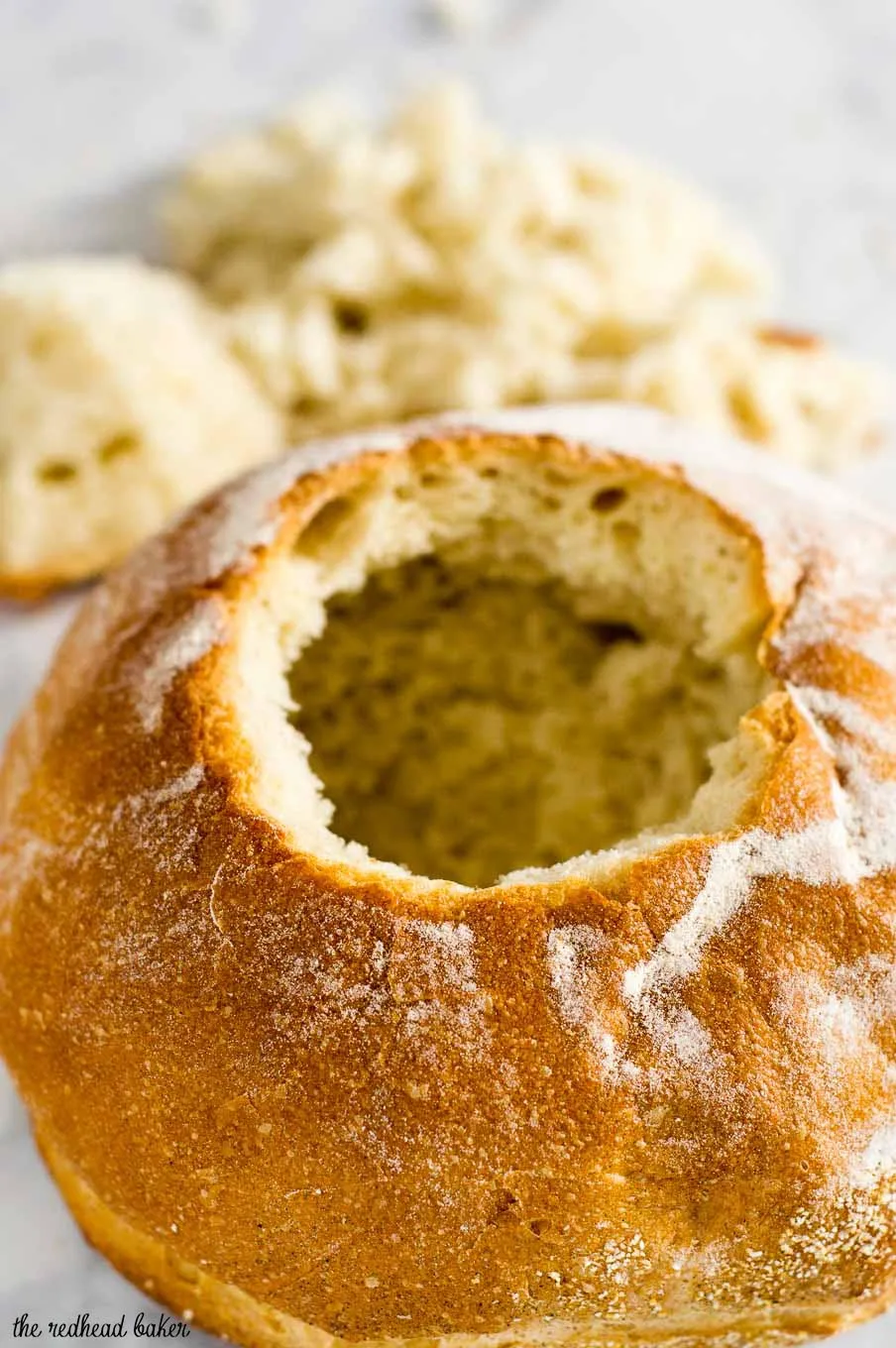 Philly cheesesteak chili has all the flavors of a traditional cheesesteak sandwich, topped with cheese and served in a hollowed-out bread bowl.