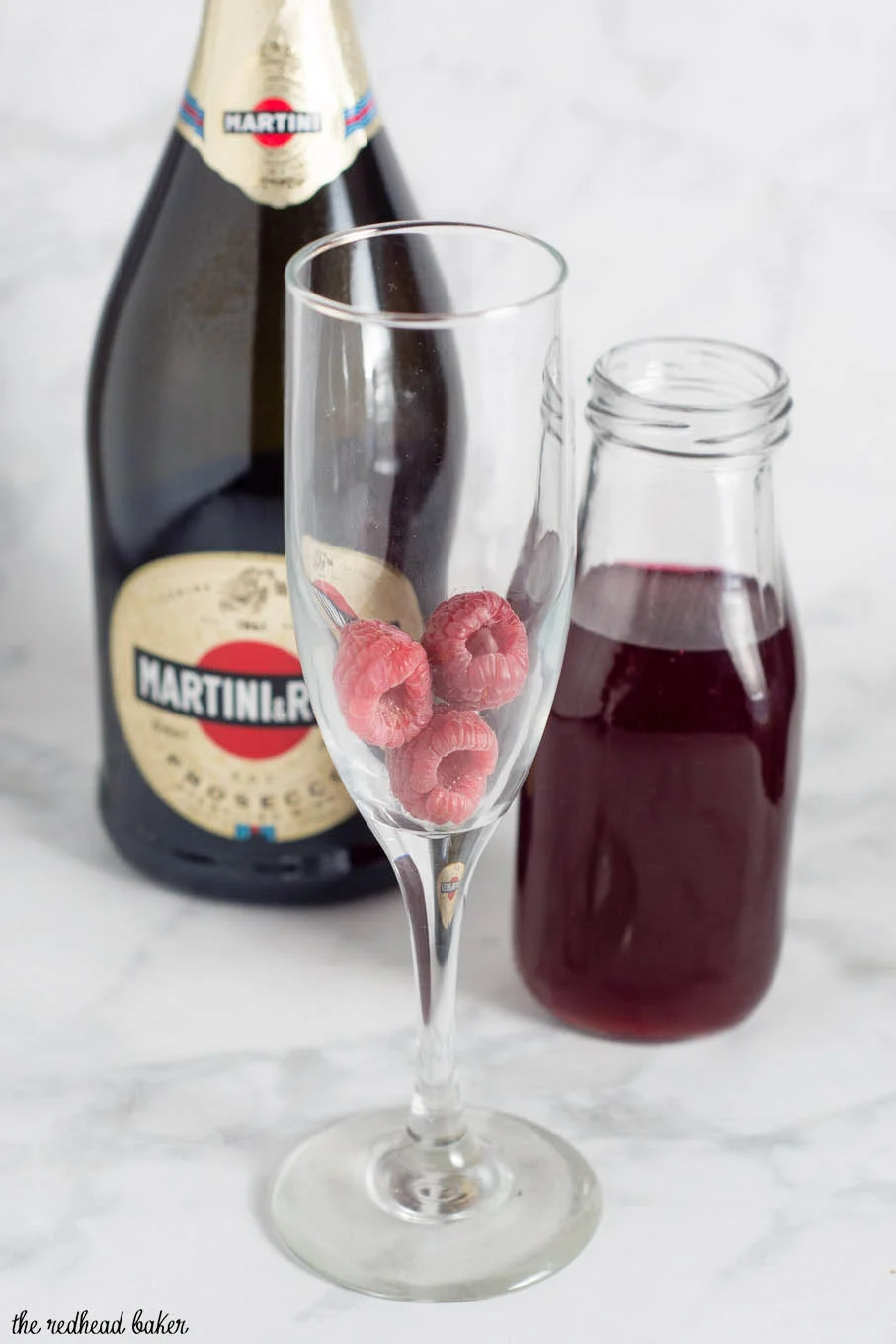 A raspberry bellini combines prosecco with sweetened berry-infused vodka, which gives the cocktail its beautiful pink hue.