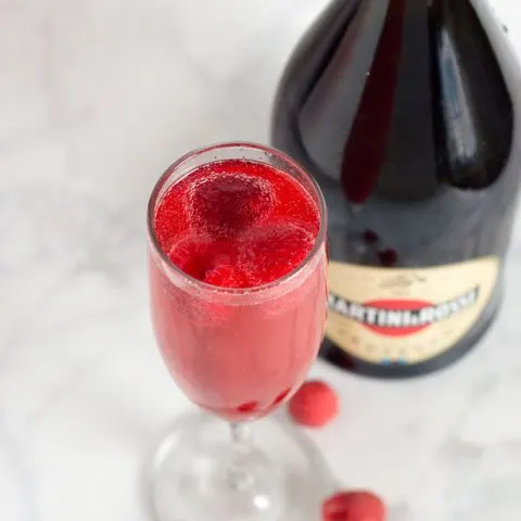 A raspberry bellini combines prosecco with sweetened berry-infused vodka, which gives the cocktail its beautiful pink hue.