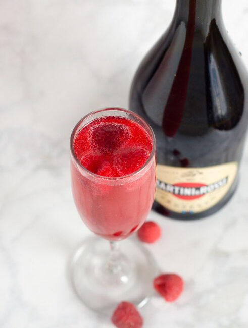 A raspberry bellini combines prosecco with sweetened berry-infused vodka, which gives the cocktail its beautiful pink hue.