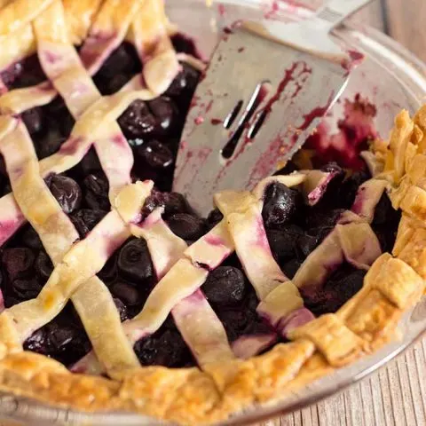 We're celebrating Pi{e} Day! Drunken cherry vanilla pie combines cherries, vanilla bean, and brandy in a flaky pie crust.