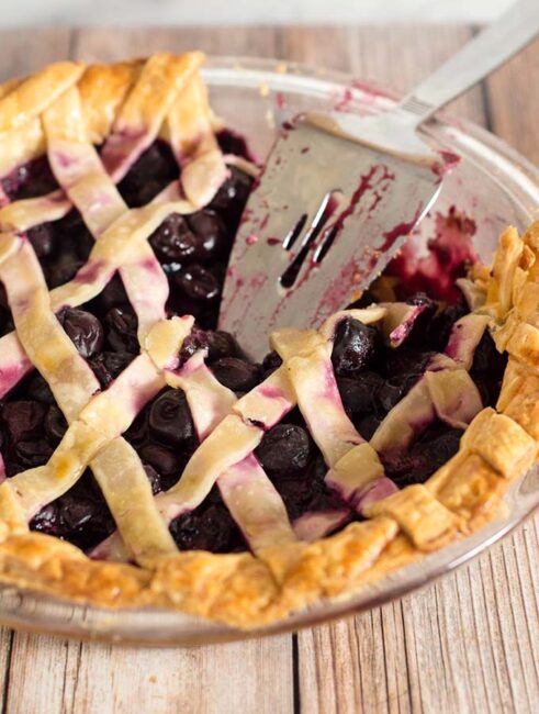 We're celebrating Pi{e} Day! Drunken cherry vanilla pie combines cherries, vanilla bean, and brandy in a flaky pie crust.