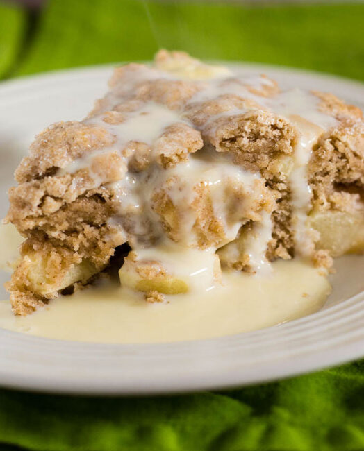 Irish apple cake has a scone-like texture and is studded with chopped apples. Serve with vanilla sauce for a delicious dessert.