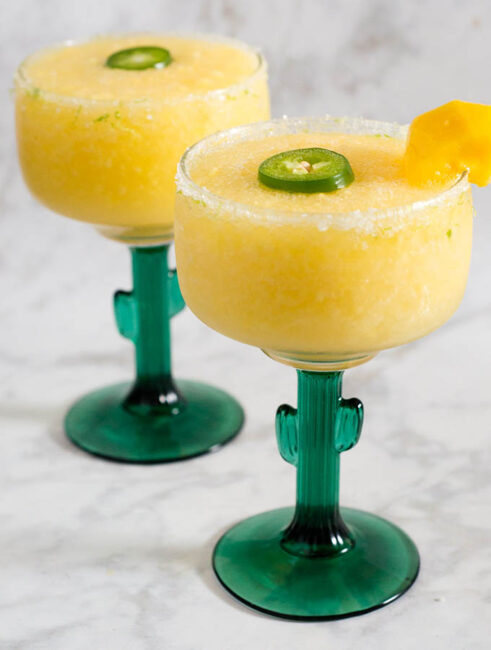 Get a Taste of Adventure with frozen mango jalapeno margaritas! Blend Nature’s Touch organic mango with jalapeno-infused tequila, triple sec and lime juice. #FlavorAdventure #ad