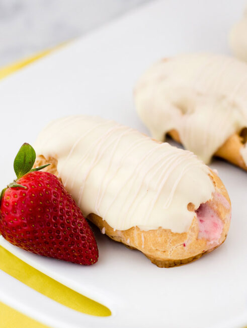 Hop into spring with strawberry-lemon eclairs, filled with fruit-flavored pastry cream then dipped in white chocolate ganache. #ad