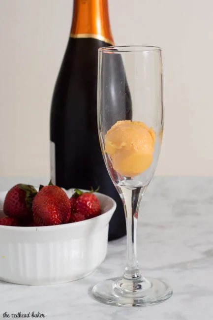Mango sorbet bellinis are made with just two ingredients, but using sorbet makes them just a little extra special. Top off with a fresh strawberry slice. #BrunchWeek