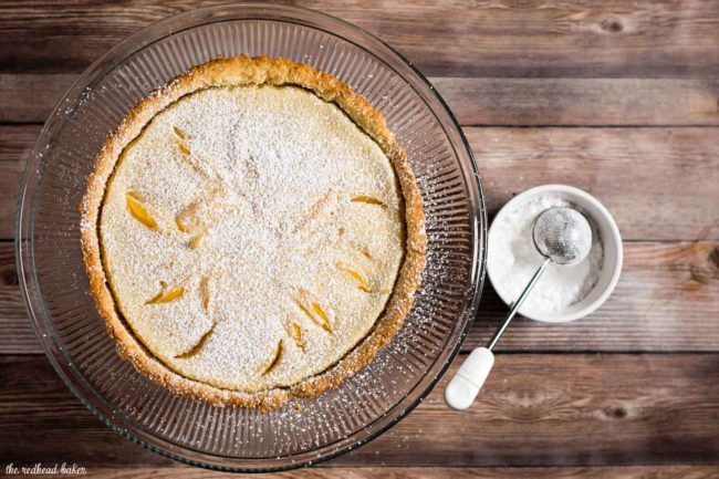 This peach custard tart has a crumbly cookie crust and a creamy custard filling loaded with tender peach slices. It's a delicious end to any meal! #BrunchWeek