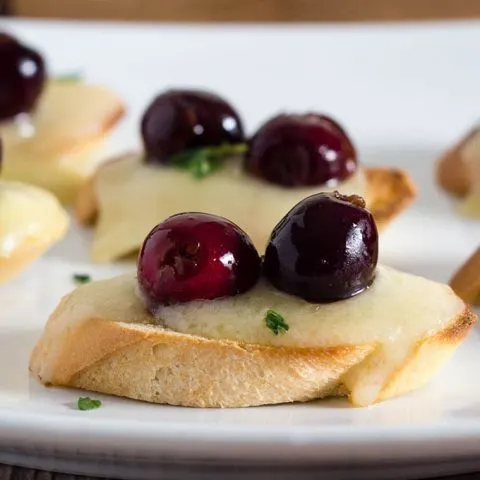 Tired of the same old appetizers? Try this cherry bruschetta — toasted baguette slices are topped with melted brie, beer-soaked cherries and fresh thyme.