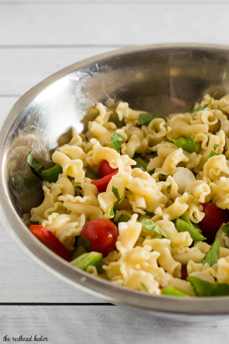 Garden pasta salad combines pasta with fresh garden vegetables, basil, and mozzarella cheese. Serve as a side salad, or add chicken or shrimp to make it a main dish.