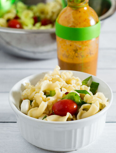 Garden pasta salad combines pasta with fresh garden vegetables, basil, and mozzarella cheese. Serve as a side salad, or add chicken or shrimp to make it a main dish.