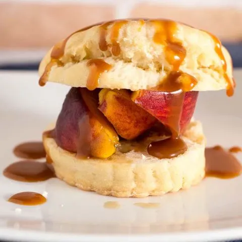 Like the classic strawberry version, peach shortcake combines a sweet biscuit with brandied brown-sugar peaches, and is topped off with a drizzle of salted caramel sauce. #CookoutWeek